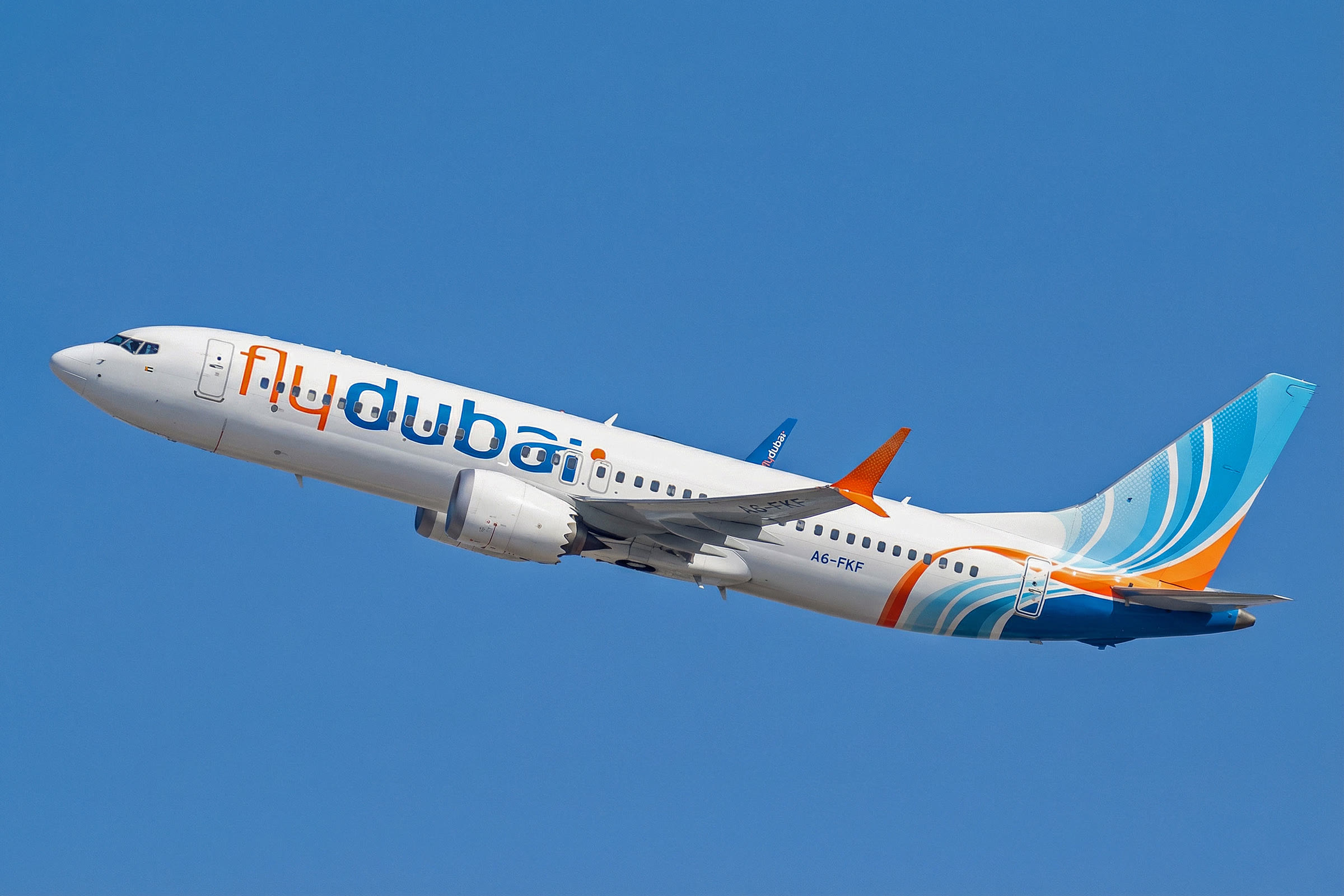 A flydubai Boeing 737 MAX 8, registration A6-FKF, climbing out of Dubai International Airport in January 2026.